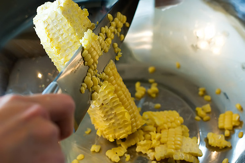 "Scraping off Corn kernel"